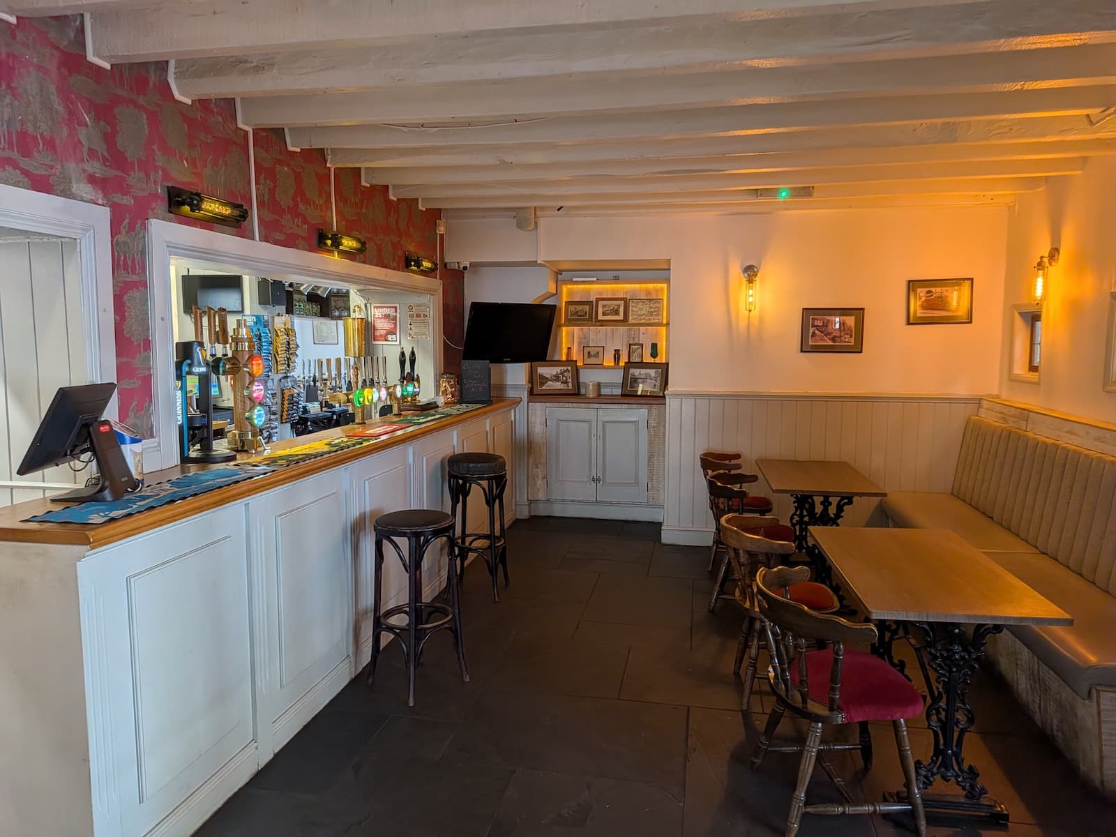 Bar area with stools and booth seating at the White Horse Inn Launceston
