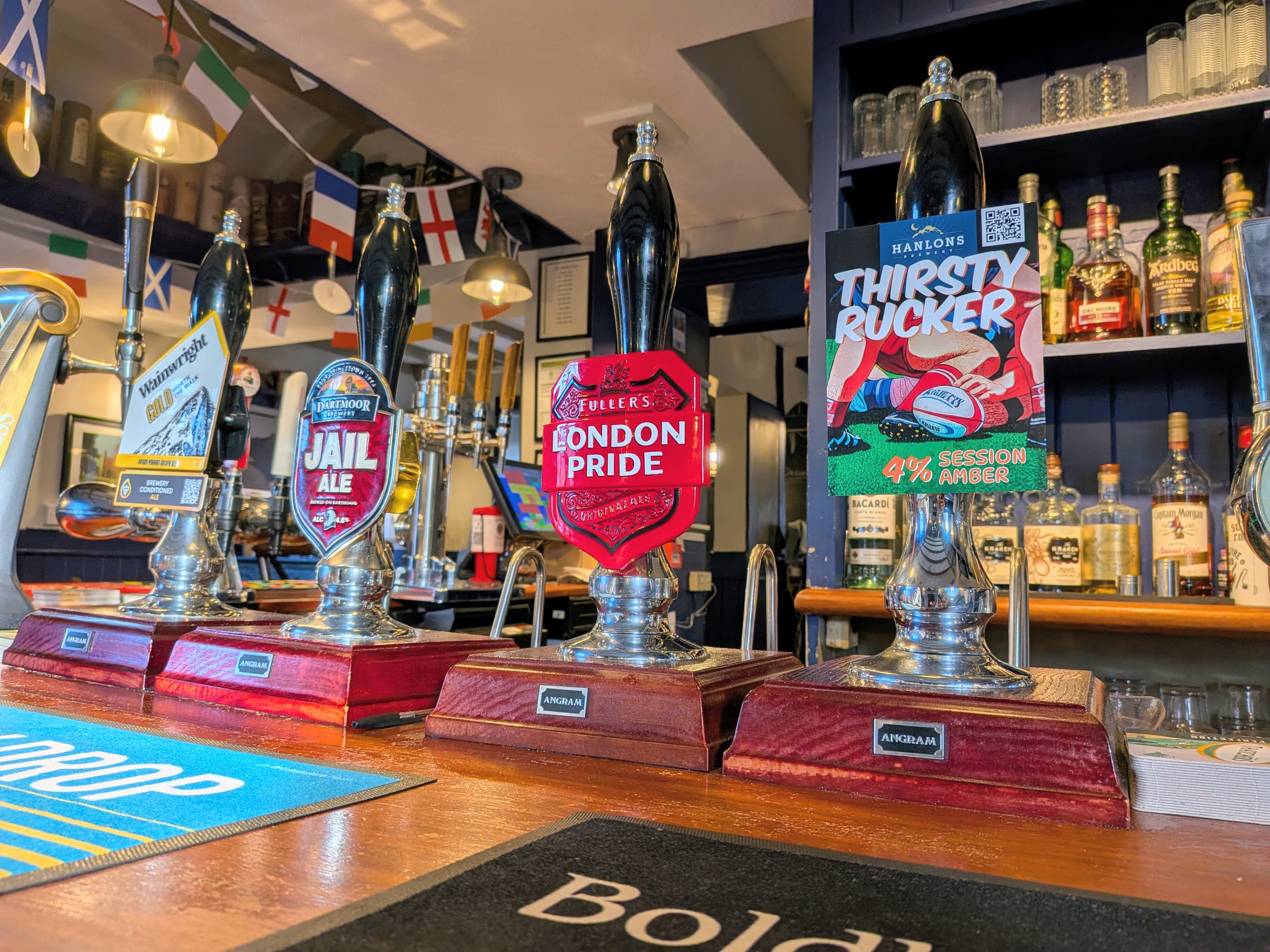 Selection of beer tap handles at the White Horse Inn Launceston